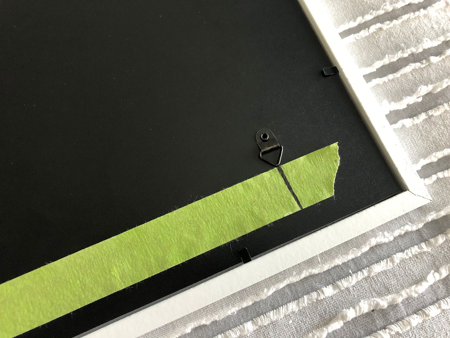 Gallery Wall and a Tip for Hanging a Picture with Two Hooks Pursuit